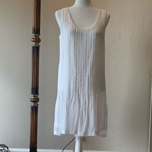 White loose fitting bodice with flared skit dress